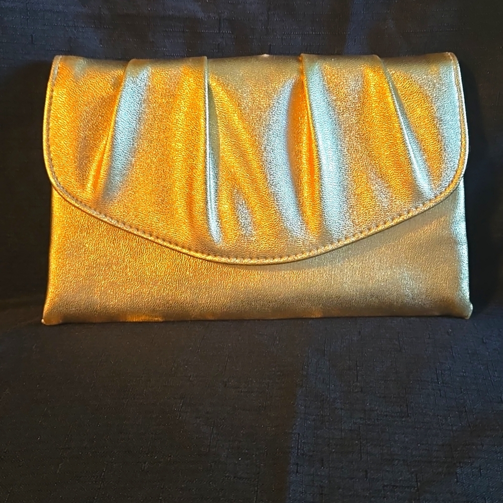 Gold clutch purse. Snap closure. No strap.